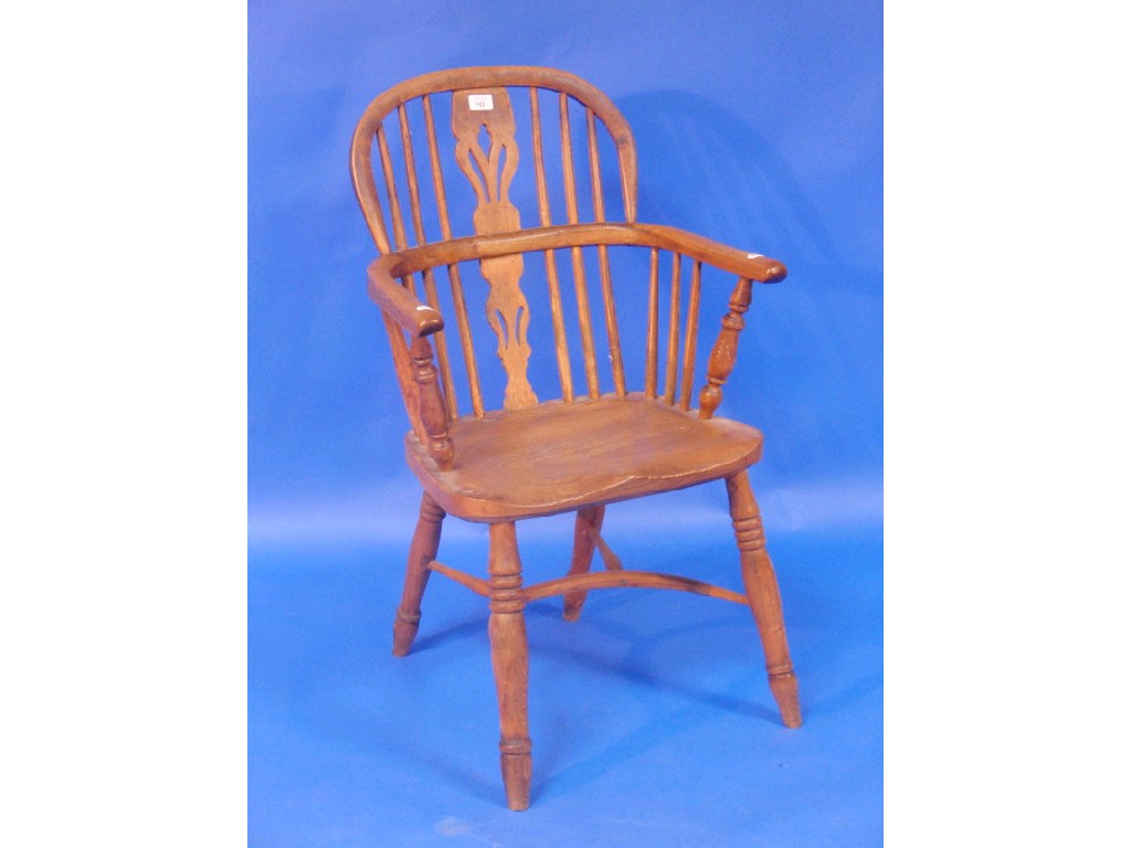 Appraisal: An elm and ash Windsor chair with pierced vase splat