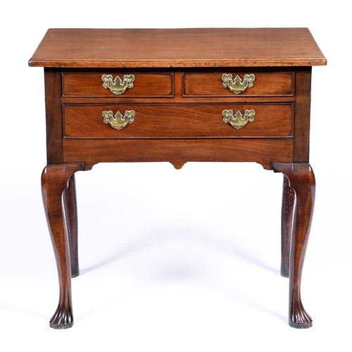 Appraisal: A George II walnut lowboy with oversailing moulded top and