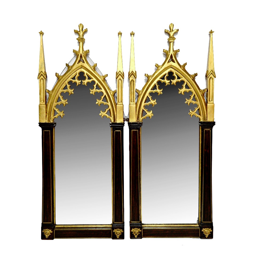 Appraisal: A pair of parcel gilt Gothic revival wall mirrors each