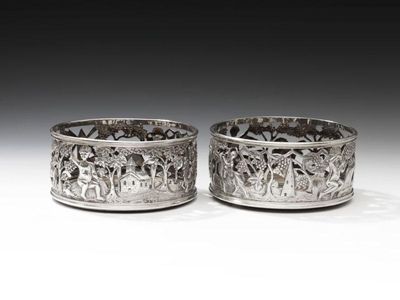 Appraisal: A pair of early-Victorian Irish silver wine coasters by James