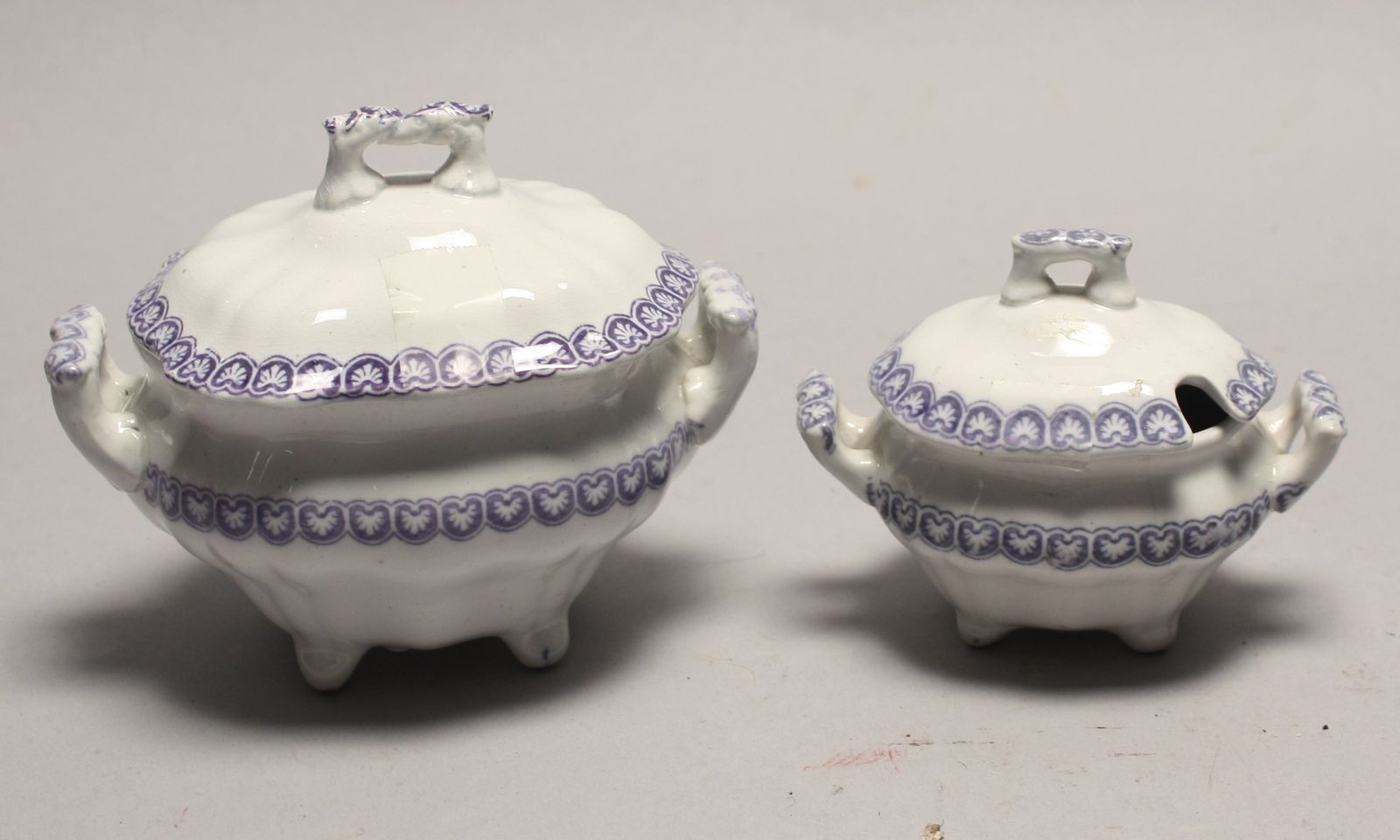 Appraisal: TWO ENGLISH IRONSTONE DOLL'S COVERED TUREENS th CenturyWith light purple