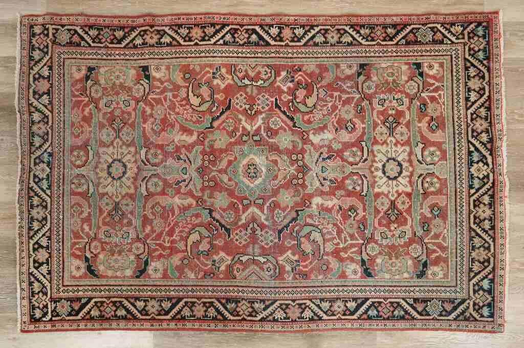 Appraisal: Persian rug Floral motifs Wear and fading throughout across field