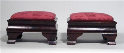 Appraisal: Pair of mahogany upholstered footstools With ogee bracket feet Height