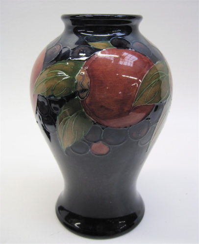 Appraisal: ENGLISH MOORCROFT ART POTTERY VASE deep blue with contrasting fruit