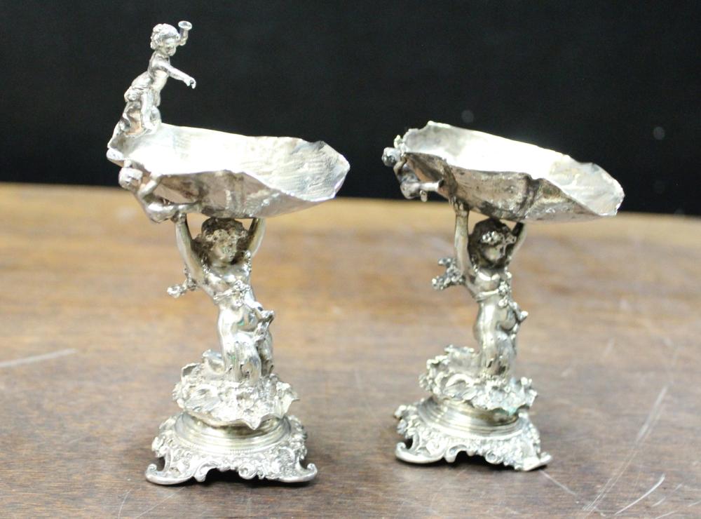 Appraisal: PAIR OF GERMAN SILVER FIGURAL COMPOTES featuring a mermaid figure