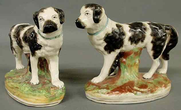 Appraisal: Large pair of th c Staffordshire Newfoundland dogs with separately