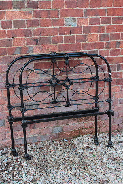 Appraisal: A PAIR OF VICTORIAN BLACK PAINTED IRON SINGLE BED HEADS