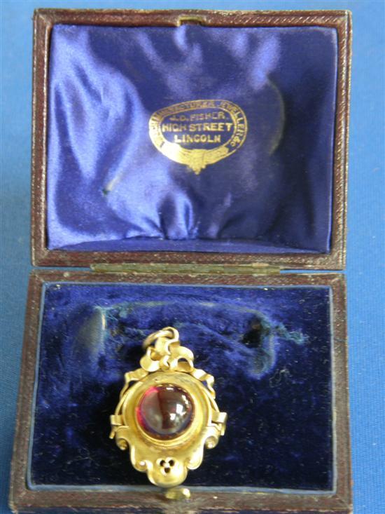 Appraisal: Gold and garnet memorial pendant