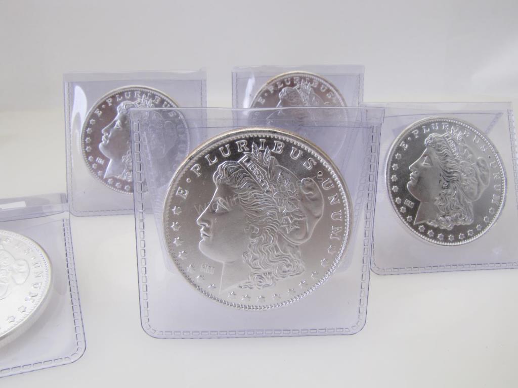 Appraisal: Five Silver Rounds and Beatles K Album Card rounds are