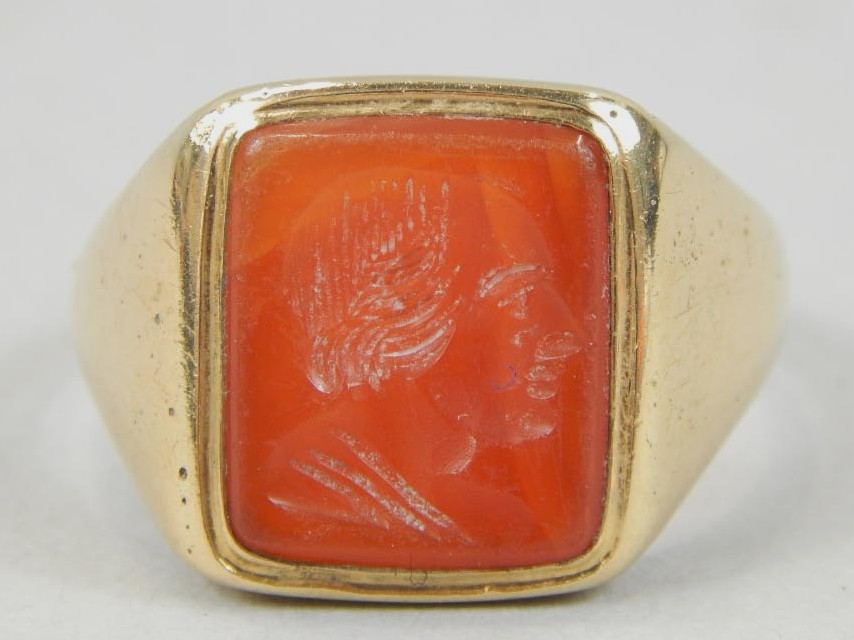 Appraisal: A gentleman's carnelian intaglio ring stamped ct g all in