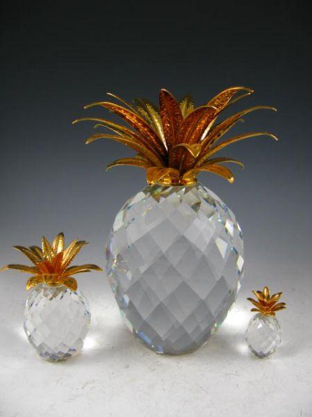 Appraisal: Swarovski Set of Three Graduated Pineapple with gilded metal caps