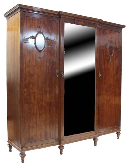 Appraisal: An Edwardian mahogany bedroom suite comprising a breakfront wardrobe with