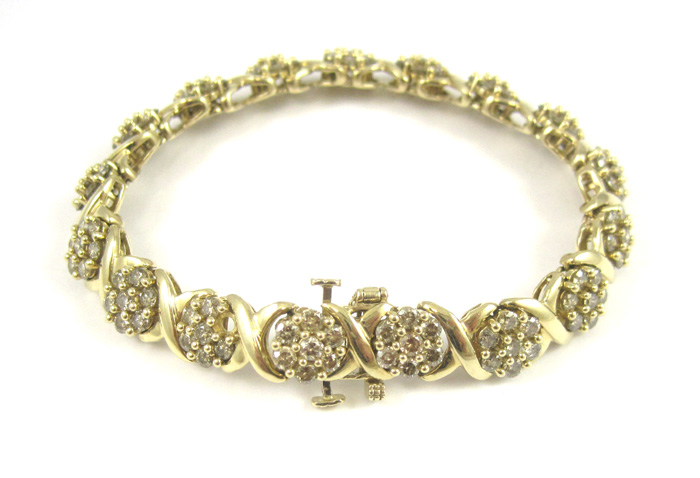 Appraisal: DIAMOND AND TEN KARAT YELLOW GOLD BRACELET measuring - inches