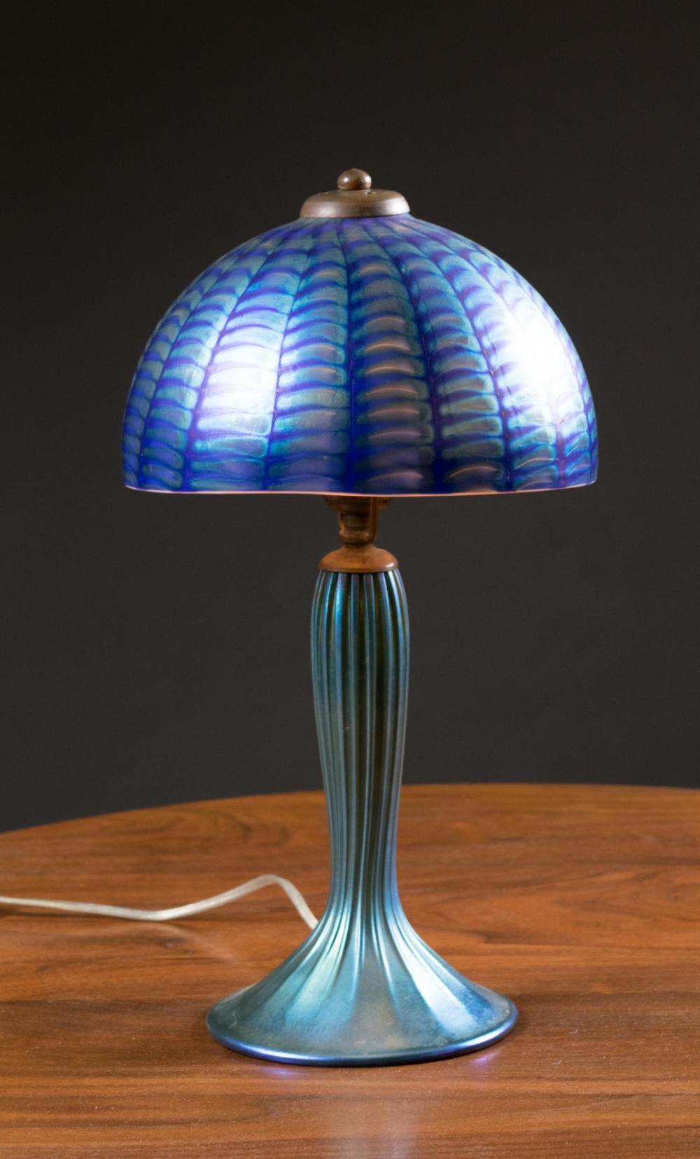 Appraisal: LUNDBERG STUDIOS ART GLASS TABLE LAMP iridescent blue the domed