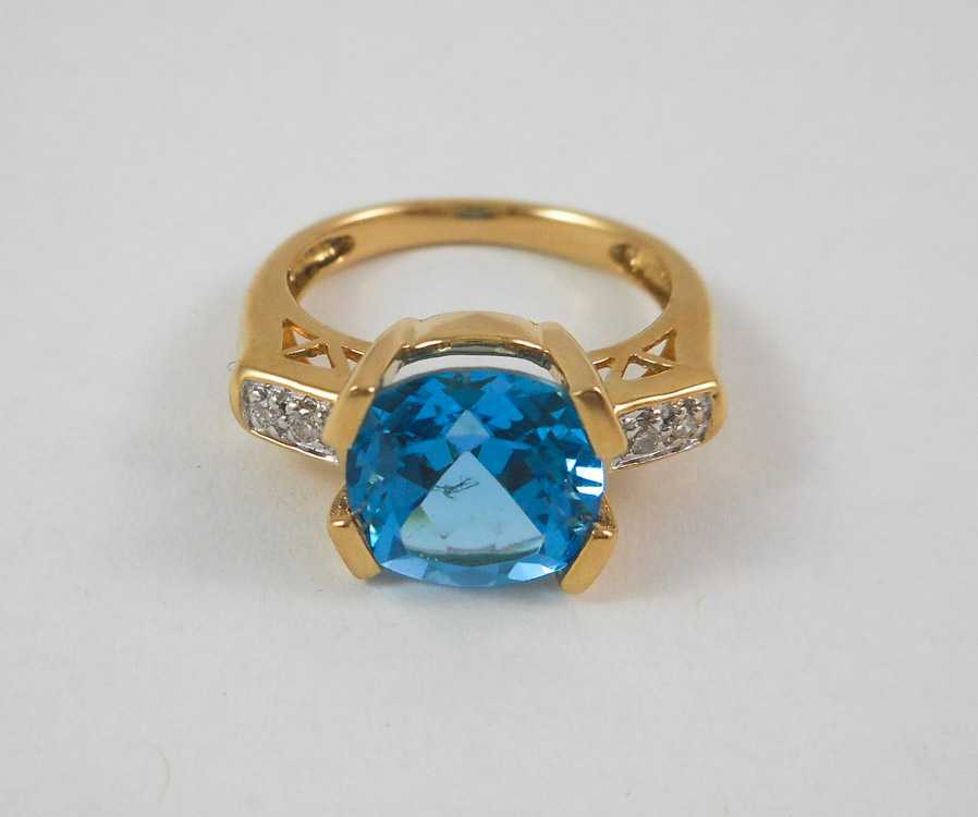 Appraisal: BLUE TOPAZ DIAMOND AND FOURTEEN KARAT GOLD RING with two