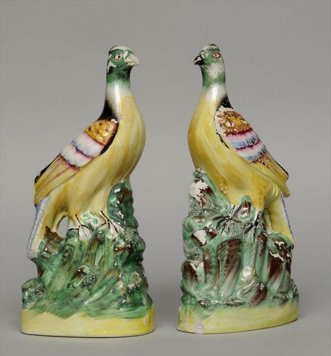 Appraisal: PAIR OF STAFFORDSHIRE BIRD FIGURES Each on naturalistically modeled base