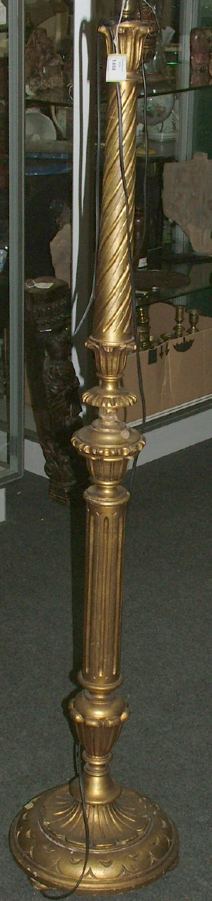 Appraisal: A carved and giltwood standard lamp with spiral and fluted