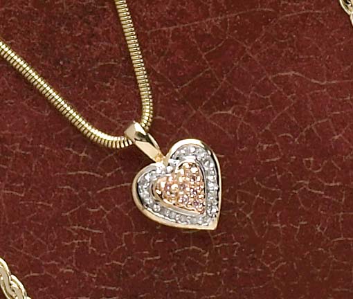 Appraisal: HEART PENDANT k yellow and rose gold heart pendant set