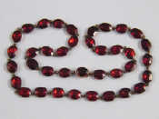 Appraisal: An antique gold garnet necklace stones each approx x mm