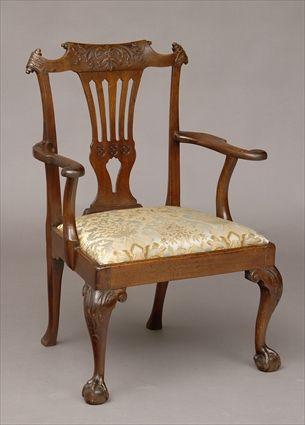 Appraisal: GEORGE II CARVED MAHOGANY OPEN ARMCHAIR The shaped foliate-carved crest