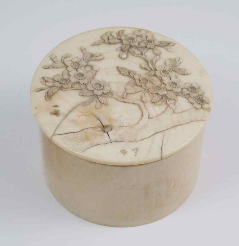 Appraisal: JAPANESE CARVED IVORY COVERED BOX Circular covered box with carved