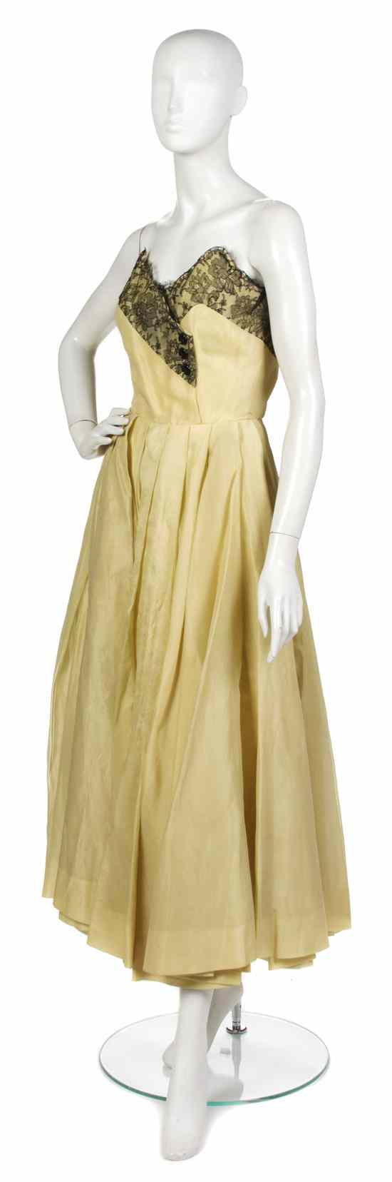 Appraisal: A Jacques Fath Yellow Organza and Black Chantilly Lace Strapless