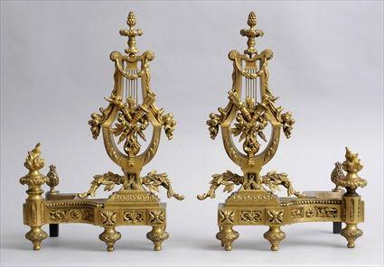 Appraisal: PAIR OF LOUIS XVI-STYLE GILT-BRONZE LYRE-FORM CHENETS Each supporting a