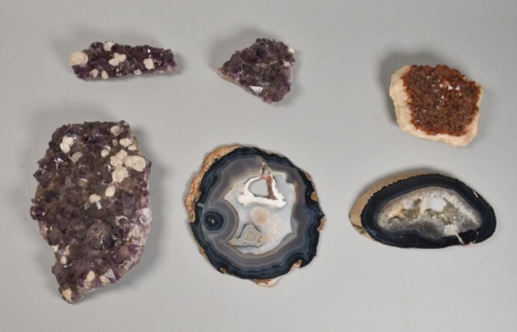 Appraisal: Collection of minerals amethysts citrine and geode slices Largest crystal