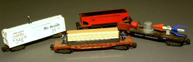 Appraisal: Four American Flyer operating cars- lumber car rocket launcher car