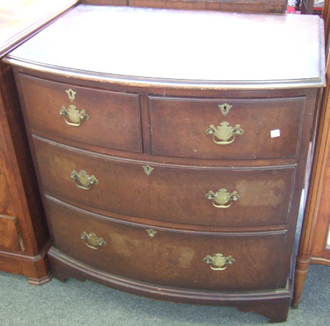 Appraisal: A Regency style small mahogany bow front chest of two