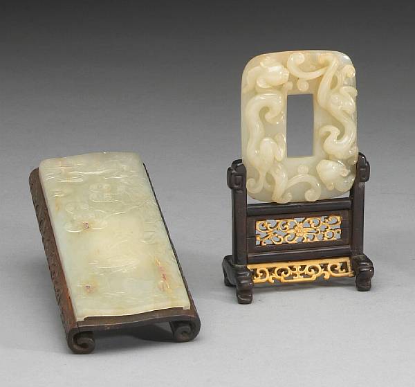 Appraisal: Two nephrite carvings The first a wrist rest thinly sectioned