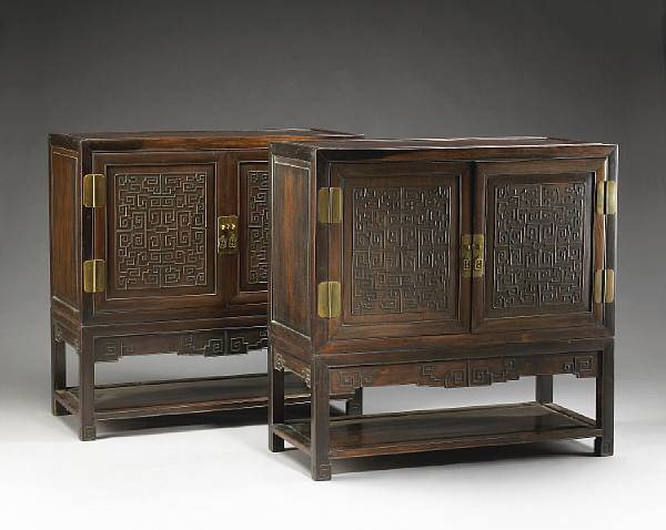 Appraisal: A pair of mixed wood two-door storage chests th Century