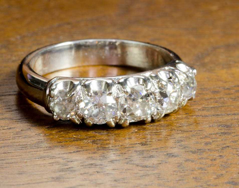 Appraisal: ESTATE DIAMOND AND PLATINUM RING set with five old mine-cut