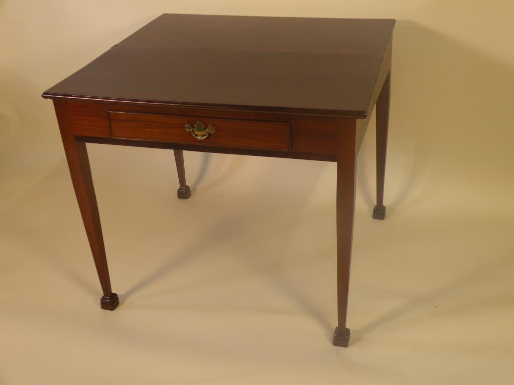 Appraisal: An early thC mahogany tea table the rectangular top above