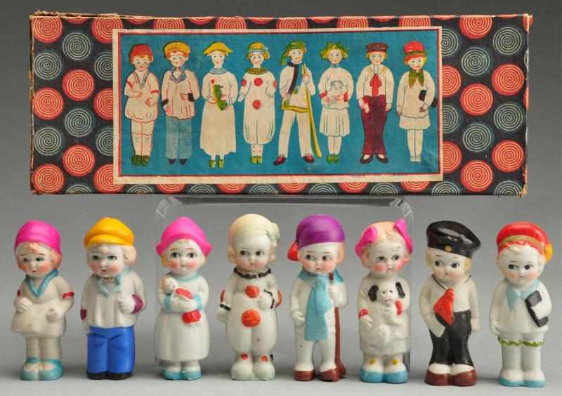 Appraisal: Japan All-Bisque Dolls in Original Box Description Immobile dolls with