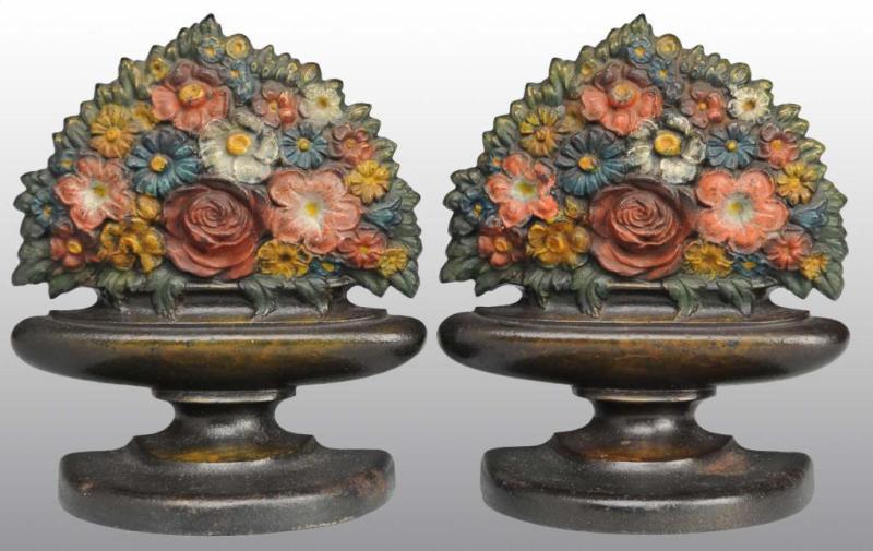 Appraisal: Cast Iron Mixed Flowers in Basket Bookends Description Made by