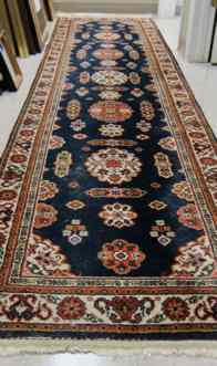 Appraisal: HAND KNOTTED ROMANIAN RUNNER Persian design featuring a variety of