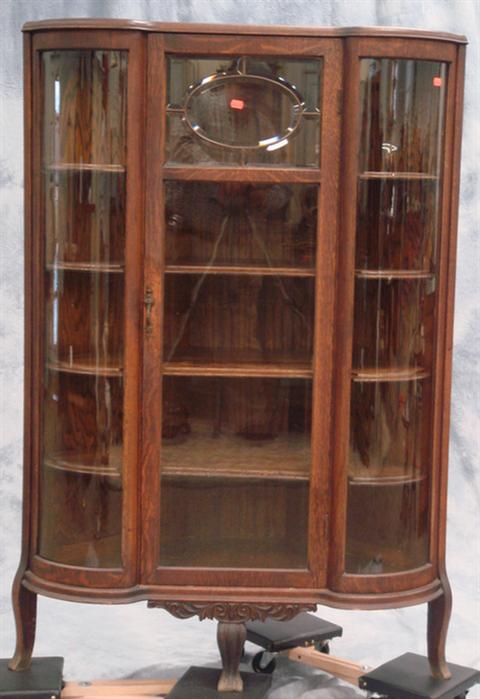 Appraisal: Victorian carved oak corner cabinet beveled leaded glass insert in