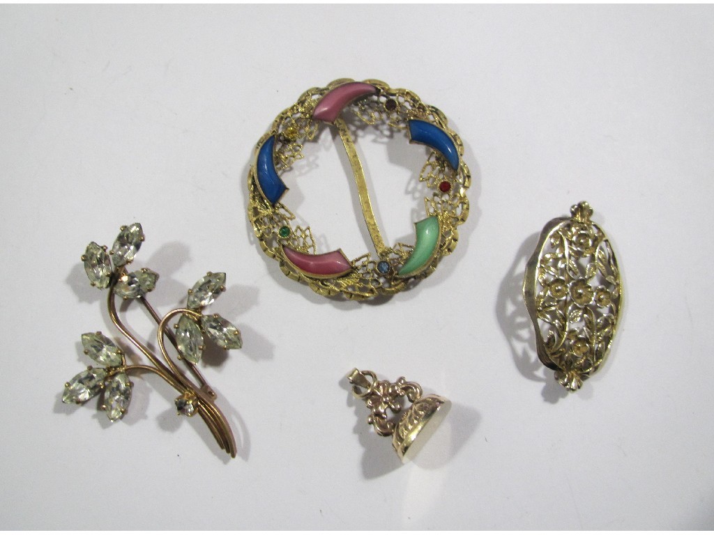 Appraisal: Lot comprising a silver brooch yellow metal fob and two