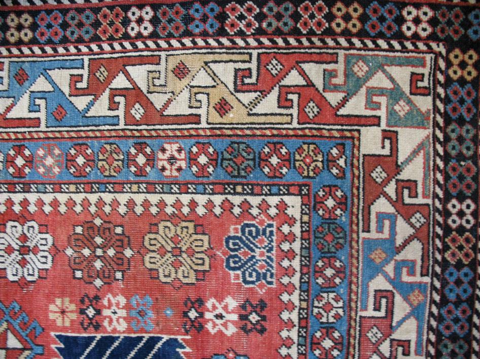 Appraisal: A SHIRVAN AKARAGASHLI RUG the brick red ground with a