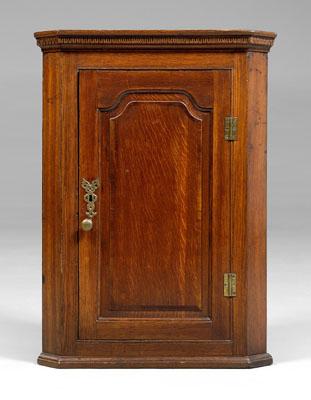 Appraisal: Oak hanging corner cupboard paneled door opening to blue-painted interior