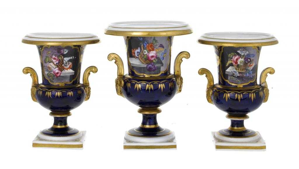 Appraisal: A STAFFORDSHIRE COBALT GROUND GARNITURE OF VASES of campana shape