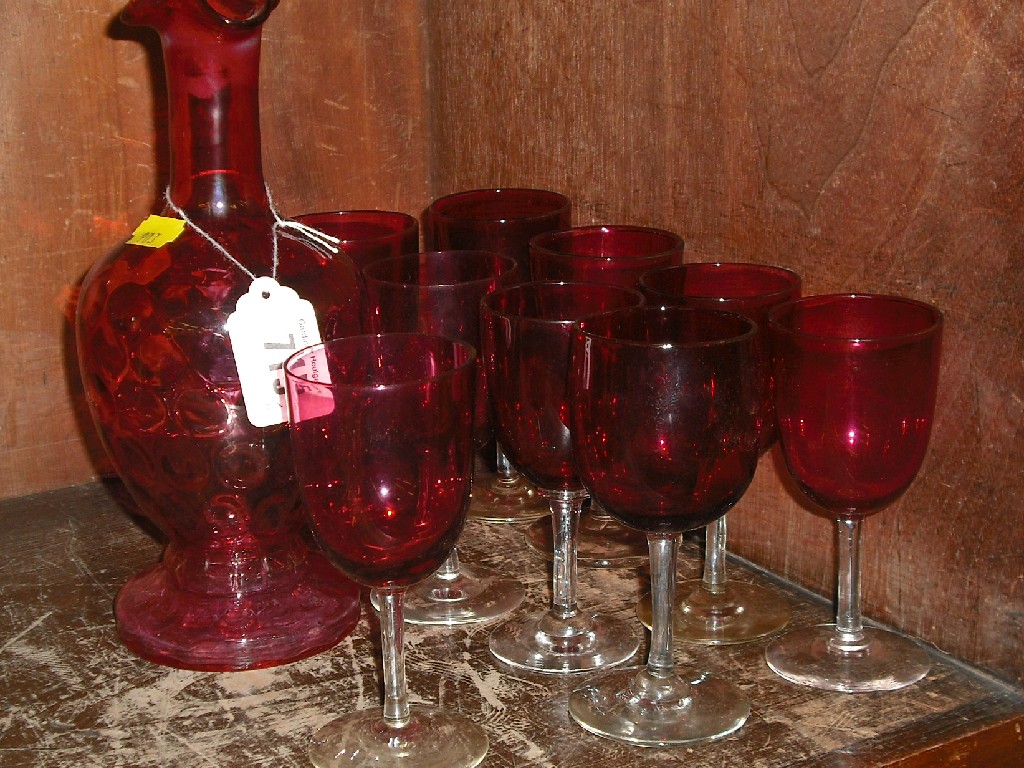 Appraisal: Nine assorted Victorian cranberry wine glasses and a cranberry carafe