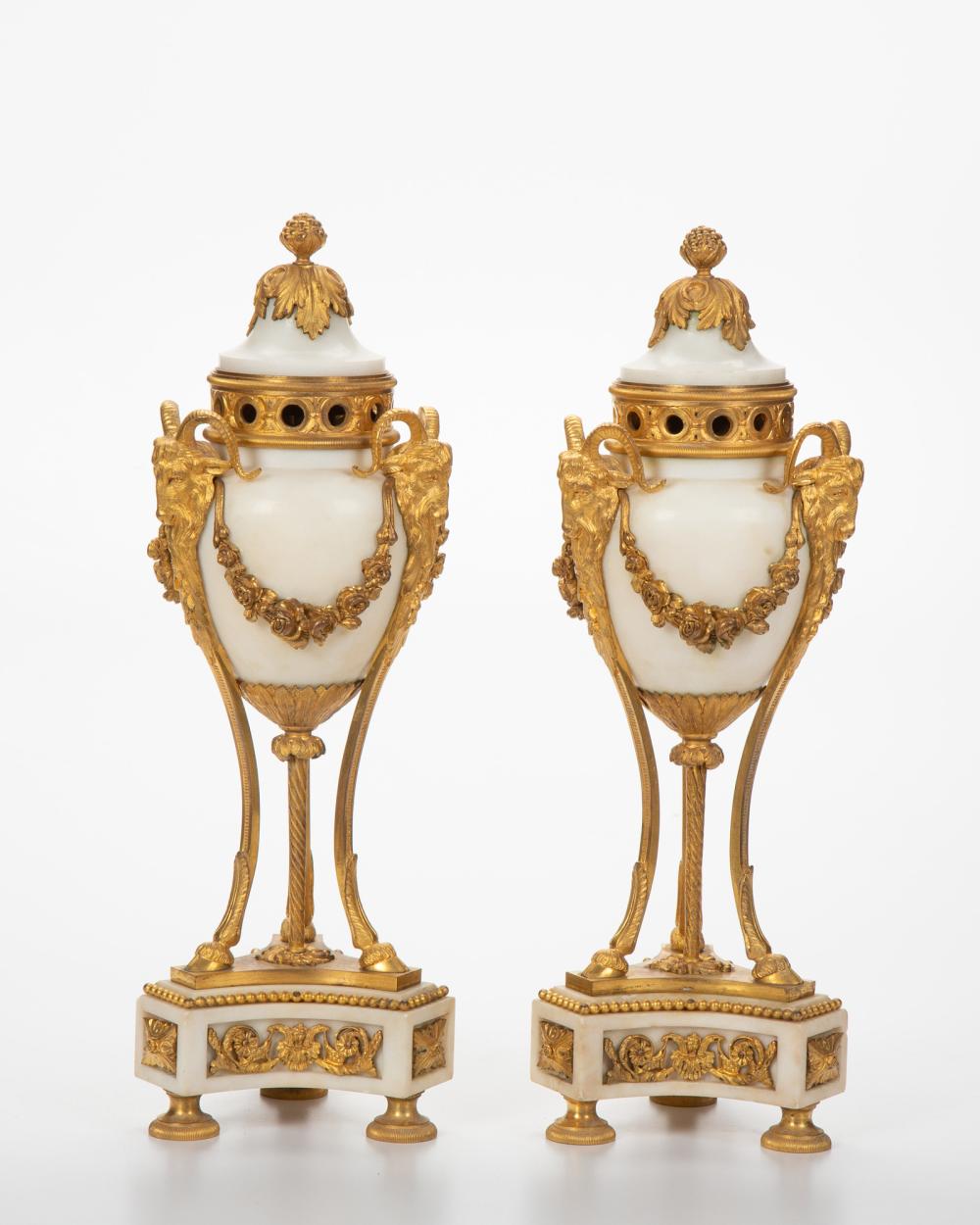 Appraisal: A pair of Louis XVI-style gilt-bronze and marble candlestick urns