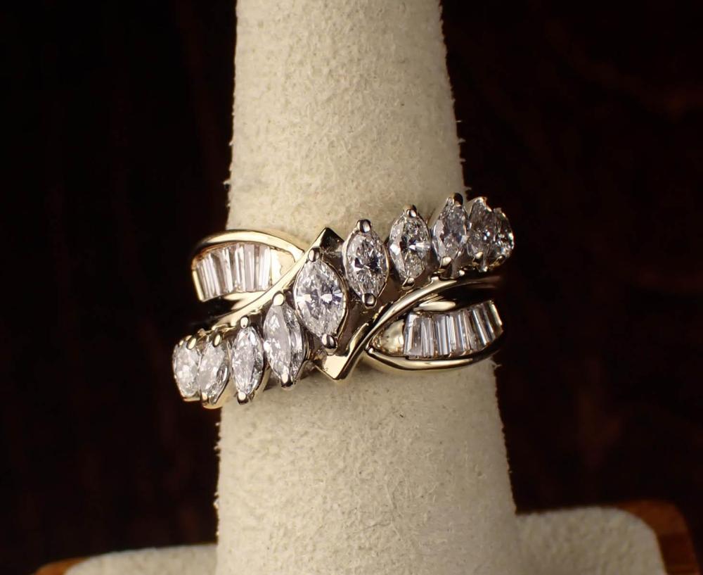 Appraisal: DIAMOND AND FOURTEEN KARAT YELLOW GOLD RING set with seven