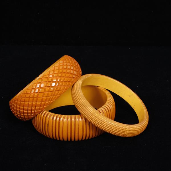 Appraisal: Three Carved Bakelite Bangle Bracelets dia