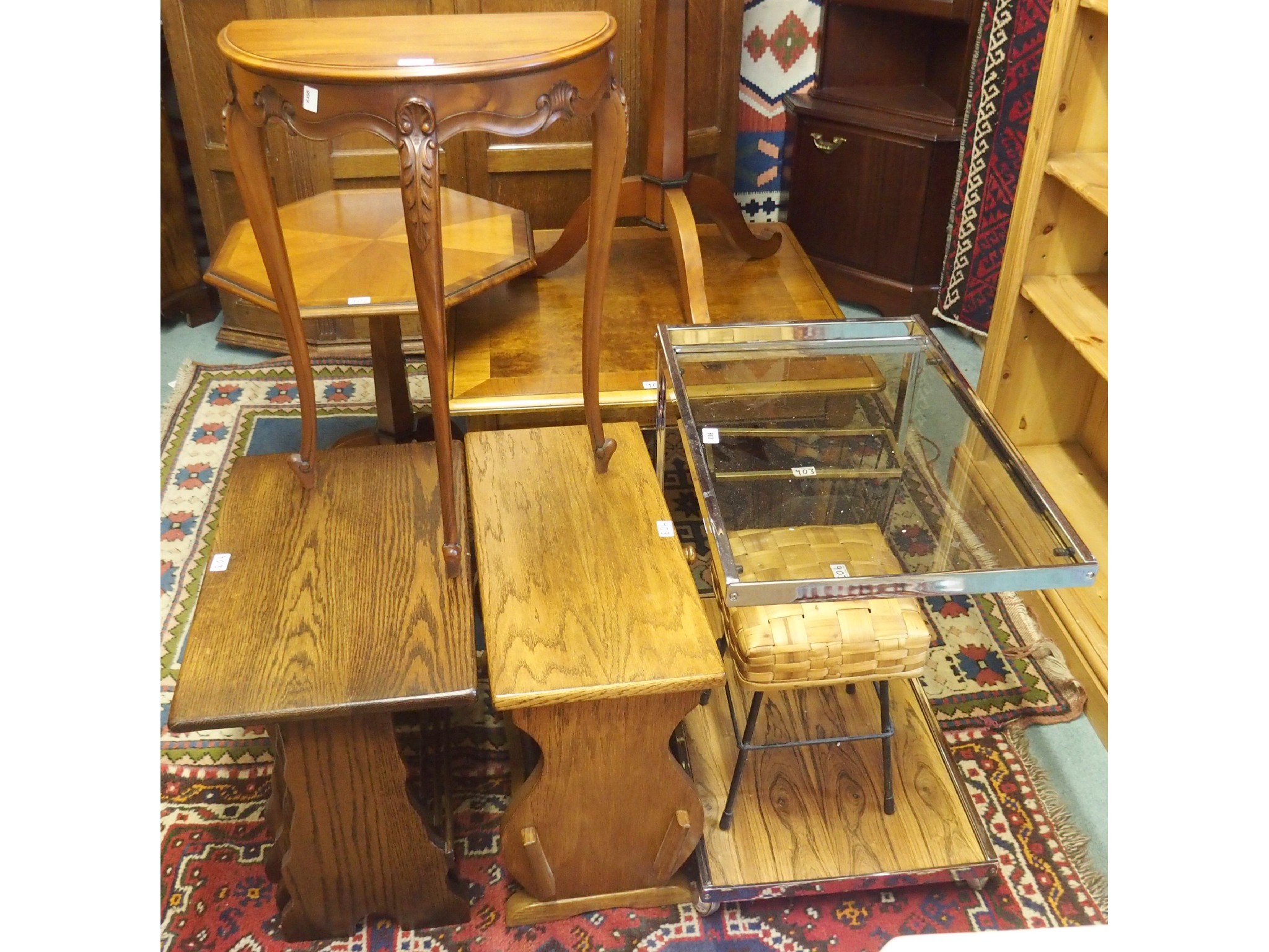 Appraisal: A chrome and glass tea trolley oak magazine rack oak