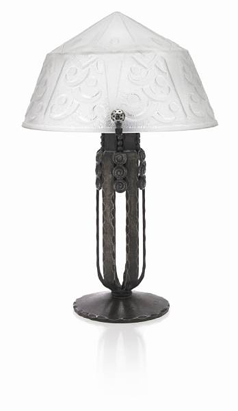 Appraisal: A Daum Nancy acid cut back glass and wrought-iron lamp