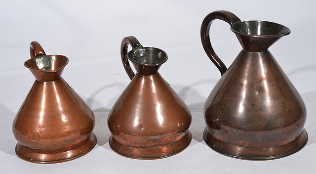 Appraisal: TWO VICTORIAN COPPER LIQUID MEASURES OF CONICAL FORM two and