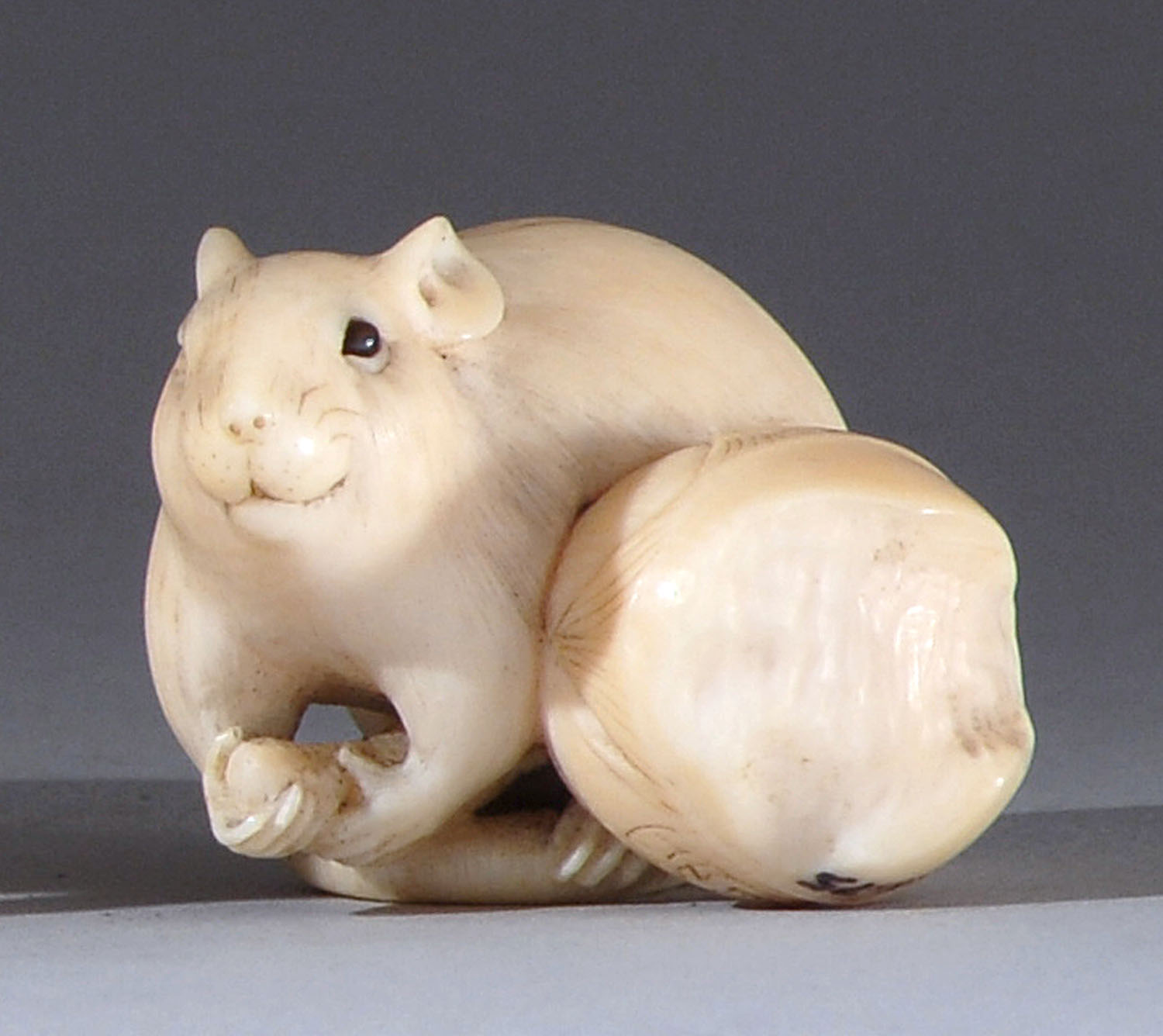 Appraisal: IVORY NETSUKE Late th CenturyBy Rantei In the form of